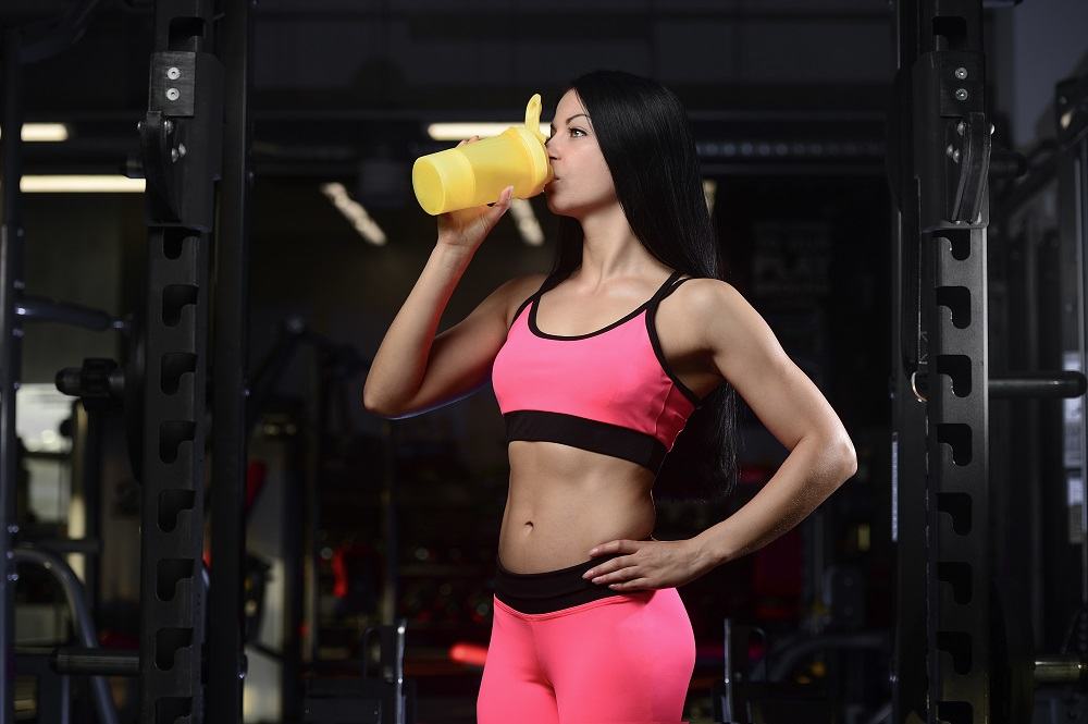 women drinking protein shake